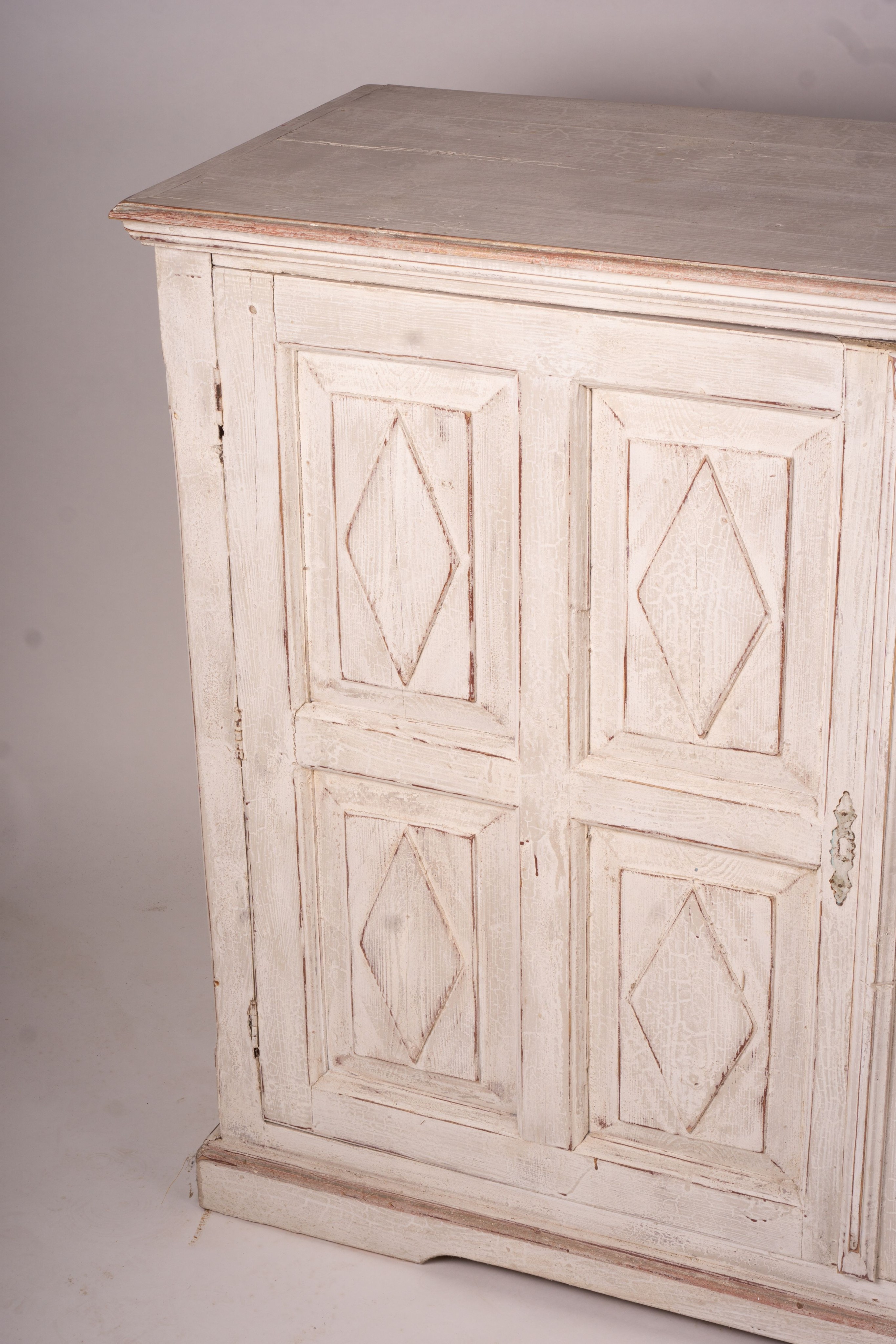 A 19th century Continental painted pine two door side cabinet, width 142cm, depth 50cm, height 106cm